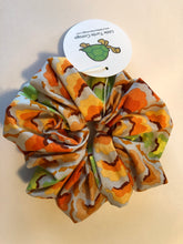 Load image into Gallery viewer, Large Hair Scrunchie with attachable bunny ears bow, Kaffe Fassett fabric, Cool Garlands Tawny