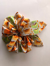 Load image into Gallery viewer, Large Hair Scrunchie with attachable bunny ears bow, Kaffe Fassett fabric, Cool Garlands Tawny